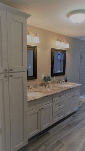 Remodeled bathroom with double vanity - home additions auburn nh