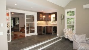 New home addition with sofas and mini bar - general contractors auburn nh