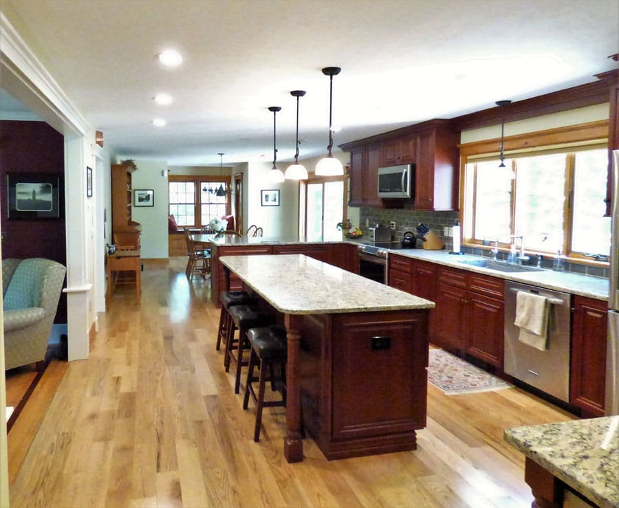 Large center island with two peninsulas for tons of seating and storage - in law apartment additions auburn nh