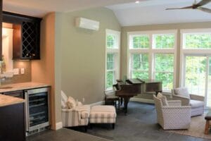 Energy efficient mini-split heats and cools the room nicely - in law apartment additions windham nh