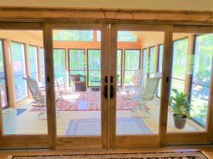 Sliding doors out to a indoor porch