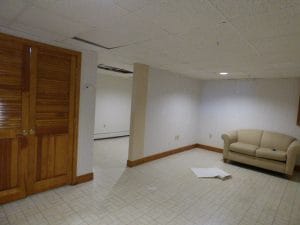 Before view of unfinished basement in North Hampton NH