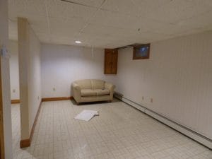 Before view of unfinished basement in Exeter NH