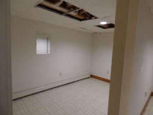Before view of basement in Hampstead NH