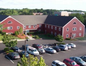 Before, no elevator and vestibule. Wood sided. - in law apartment additions windham nh