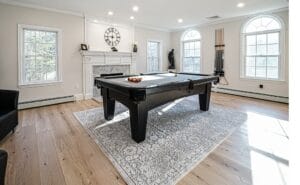Remodeled living room with pool table - general contractors auburn nh